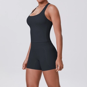 Side view of black two-piece sports set featuring racerback tank top and high-waist shorts