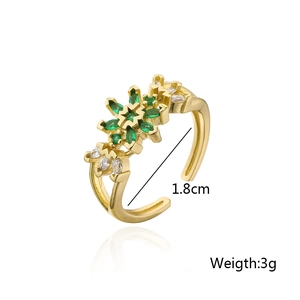Detail showing 1.8cm diameter and 3g weight of gold ring with green zircon stones