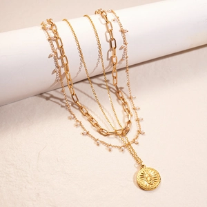 Layered 18K gold plated stainless steel necklace with sun coin pendant and pearls