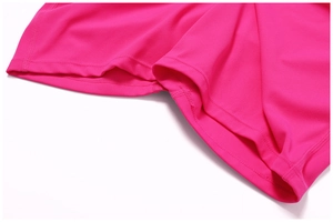 Detail of high-stretch bright pink yoga jumpsuit fabric with fine double-needle stitching