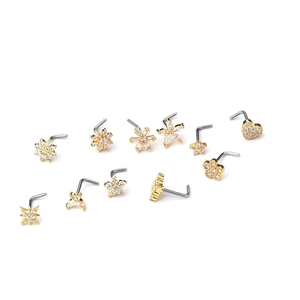 Set of 11 golden L-shaped 20G stainless steel nose studs with cubic zirconia in various shapes