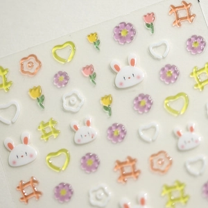 3D embossed nail stickers featuring macaron rabbits, flowers, and crystal heart patterns