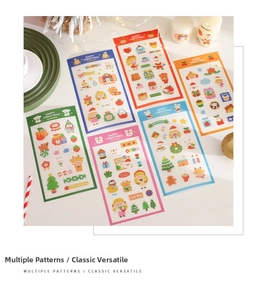 Detailed view of six colorful Christmas sticker sheets with Santa and reindeer motifs