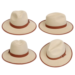 Detail view of beige woven straw jazz hat with brown leather belt and trim design