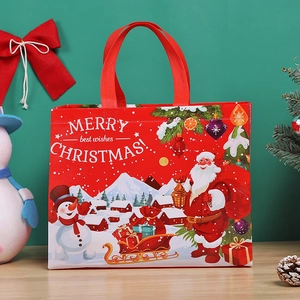Red Christmas non-woven gift bag featuring Santa and Snowman with sturdy handles