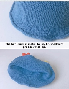 Close-up of blue knitted baby bucket hat showing detailed stitching and textured yarn