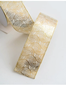 Close-up of white and gold Christmas ribbon with metallic wire woven wave patterns