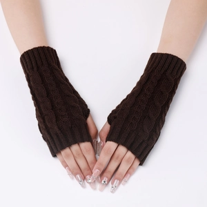 Detail view of dark brown cable knit fingerless gloves showing texture on arm