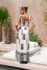 Detail of the backless smocked waist and vintage print on this women's beach maxi dress