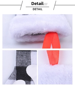 Macro detail of Christmas utensil holder with faux fur edge and red ribbon loop