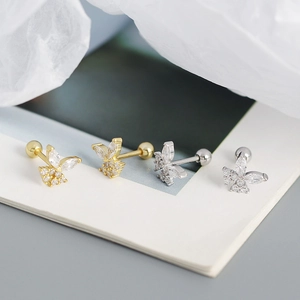 Macro shot of S925 silver butterfly earrings with sparkling cubic zirconia and screw backs