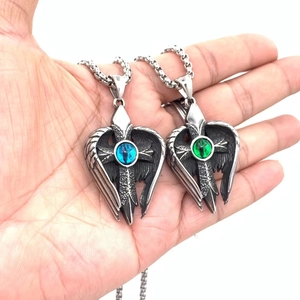 Vintage titanium steel necklace featuring angel wings with a blue and green devil eye pendant