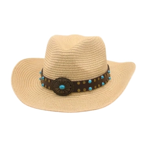 Detail of straw cowboy hat with leather band and turquoise metal flower badge