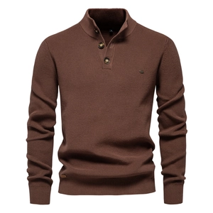 Detail of men's dark brown knit sweater showing high-quality texture and buttoned stand collar