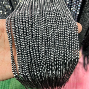 Macro shot of faceted terahertz energy beads with high-density metallic luster