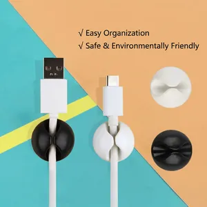 Circular silicone cable organizer clips for tidy desktop management in black and white