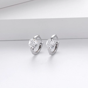 Macro view of sterling silver hoop earrings with clear round cubic zirconia stones