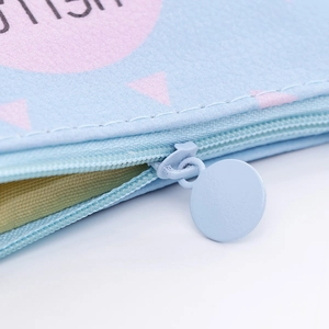 Macro detail of light blue PU leather coin purse with metal zipper and fish pattern