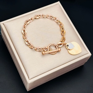 Rose gold OT toggle heart bracelet with sparkling pavé crystals and polished double charms