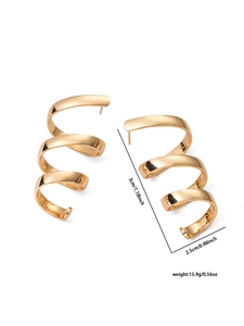 Macro view of gold spiral earrings with detailed triple-layer curved geometric dimensions
