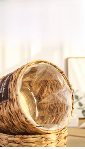 Detail of hand-woven wicker flower basket showing the internal waterproof plastic lining