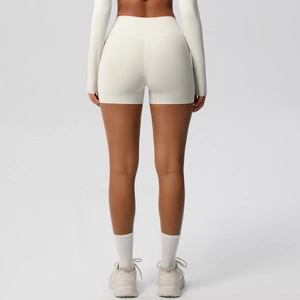 Rear view of cream high-waisted yoga shorts showing tummy control and butt lifting design