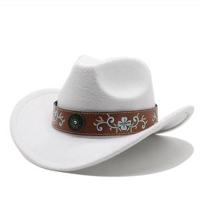 Detailed view of white felt cowboy hat featuring brown leather band with floral embroidery