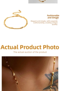 Close-up of golden mixed texture snake chain and twisted link necklace on a model