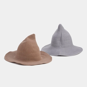 Detailed knit texture of khaki and grey pointed wizard hats with wavy brim design
