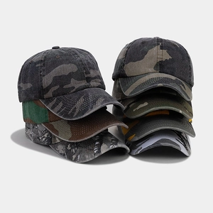 Detailed view of durable cotton canvas texture and multi-color camouflage prints on caps