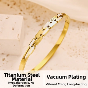 Detailed macro view of the gold titanium steel LOVE heart bangle with enamel inlay