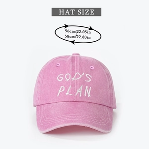 Detailed view of pink washed cotton baseball cap showing God's Plan embroidery and 56-58cm size