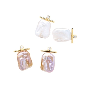 Elegant baroque pearl drop earrings in white and lavender with gold accents and diamonds