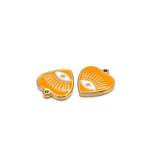 Detail of two orange heart evil eye charms with gold edges and enamel finish