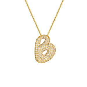 Macro shot of 18K gold plated heart pendant with pavé set zircon stones on chain