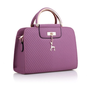 Elegant purple quilted leather handbag with gold deer charm and arc metal handle