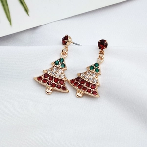Detail shot of Christmas tree earrings with colorful rhinestones on gold base
