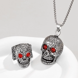 Retro skull jewelry set with red gemstone eyes including ring and necklace pendant
