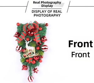 Detailed view of Christmas teardrop wreath with plaid bow, red baubles and white reindeer