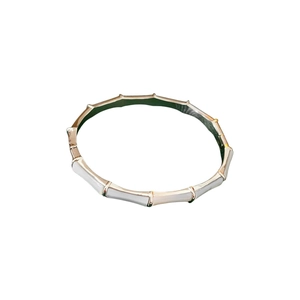 Elegant gold plated bamboo joint bracelet with white shell inlays on white background