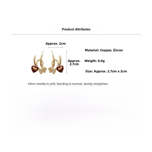 Detailed view of gold plated earrings featuring red heart and zircon dog charms with size marks