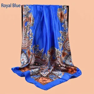 Detailed view of Royal Blue square silk scarf with vintage floral and paisley patterns