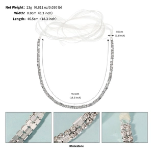 Detailed view of silver rhinestone belt and headband with measurement specifications