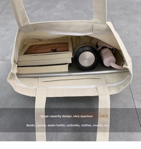 Spacious canvas tote bag interior showing books, tablet, and water bottle for daily use
