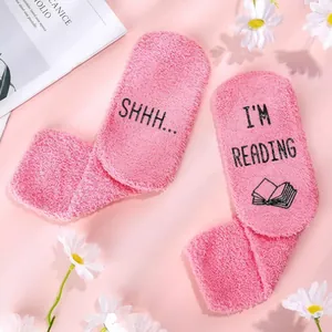 Pink fuzzy coral fleece thermal socks with SHHH I'M READING text and daisy decor
