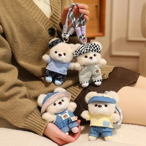 Set of four cute teddy bear plush keychains in assorted handmade outfits and hats