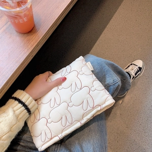Lightweight white quilted clutch bag with cute red rabbit patterns and side logo label