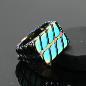Macro detail of titanium steel ring with colorful geometric texture and iridescent finish
