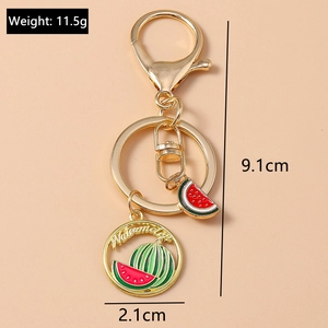 Detail of creative watermelon keychain showing golden hardware and size dimensions
