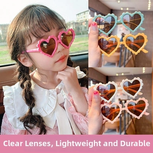 Detail of cute heart-shaped kids sunglasses with unique wavy frames in multiple colors